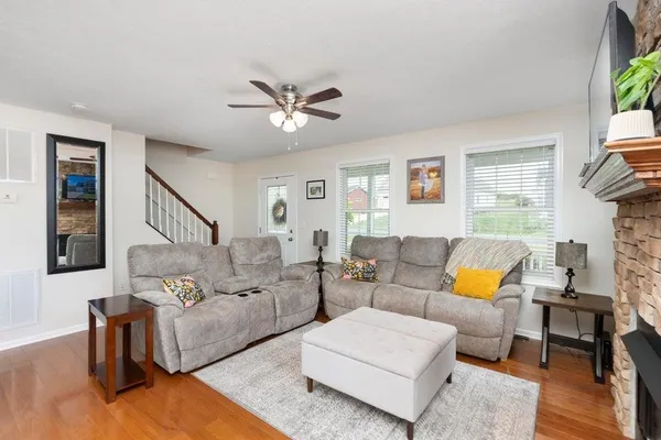 a living room with furniture and a flat screen tv