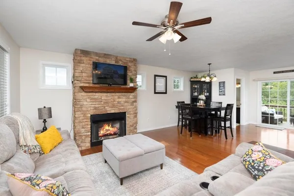 a living room with furniture and a fireplace