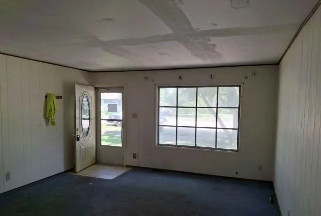 an empty room with windows