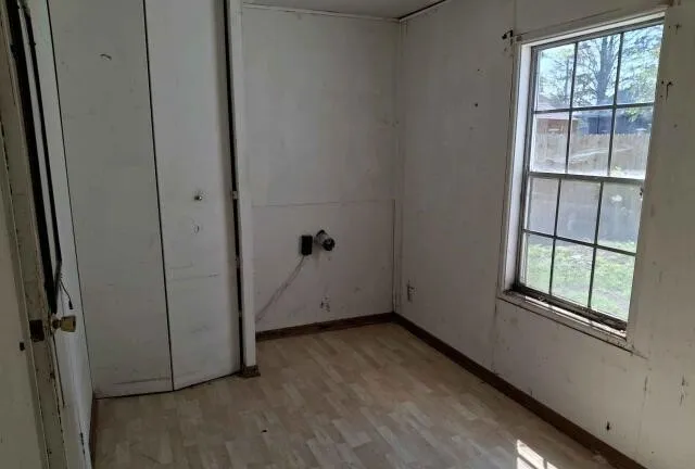 a view of a house with a yard and pathway