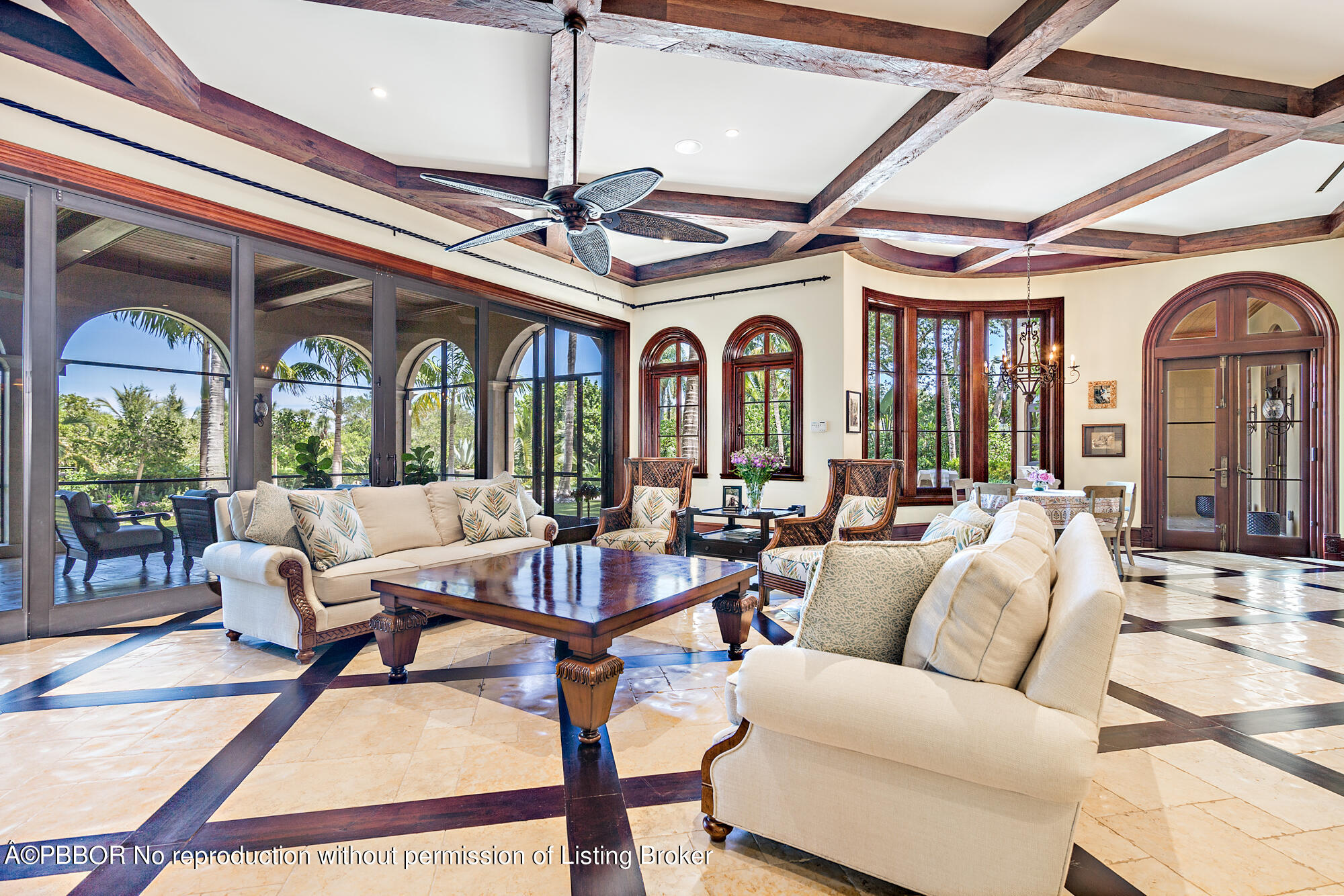 12358 Ridge Road North Palm Beach, FL 33408 - Photo 17 of 36 a living room with furniture ceiling fan and a rug