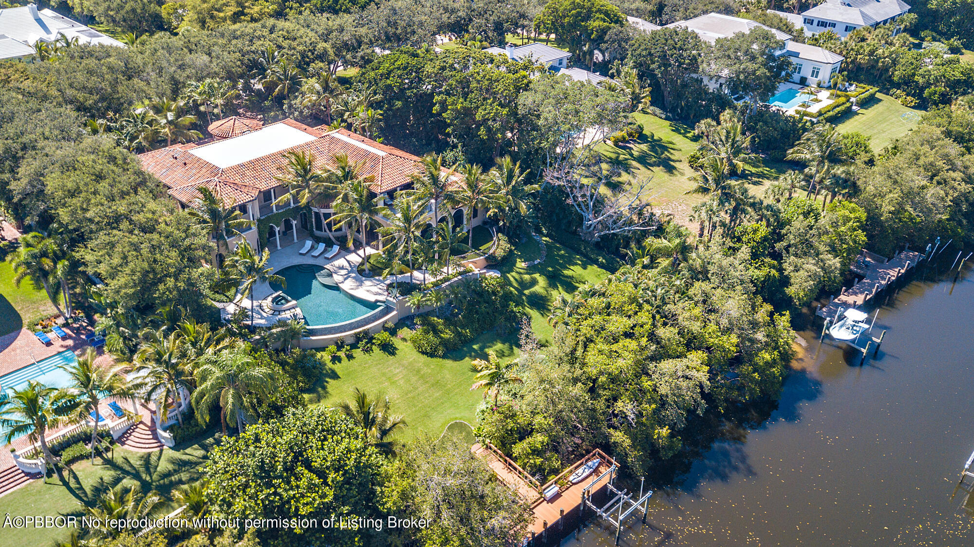 12358 Ridge Road North Palm Beach, FL 33408 - Photo 2 of 36 an aerial view of a house with a yard and garden