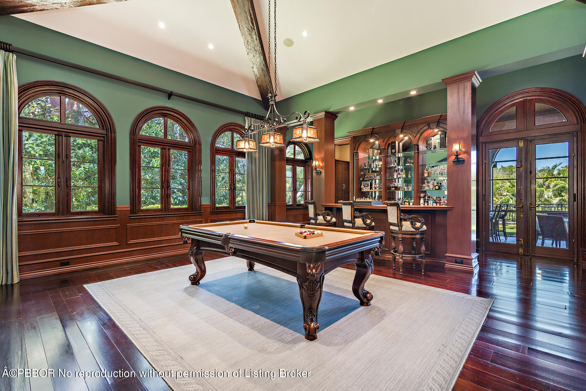 12358 Ridge Road North Palm Beach, FL 33408 - Photo 22 of 36 a room with lots of wooden furniture and a large window