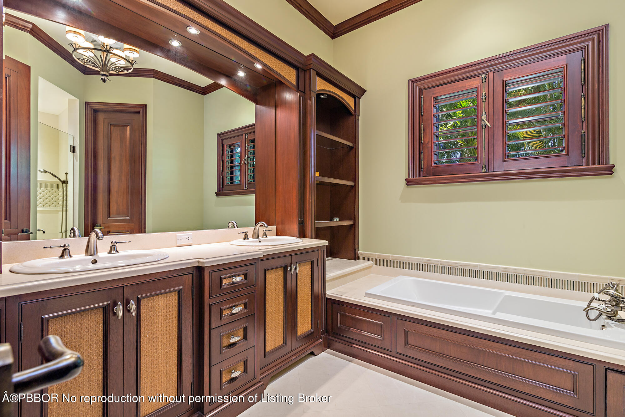 12358 Ridge Road North Palm Beach, FL 33408 - Photo 32 of 36 a spacious bathroom with a granite countertop sink and a mirror