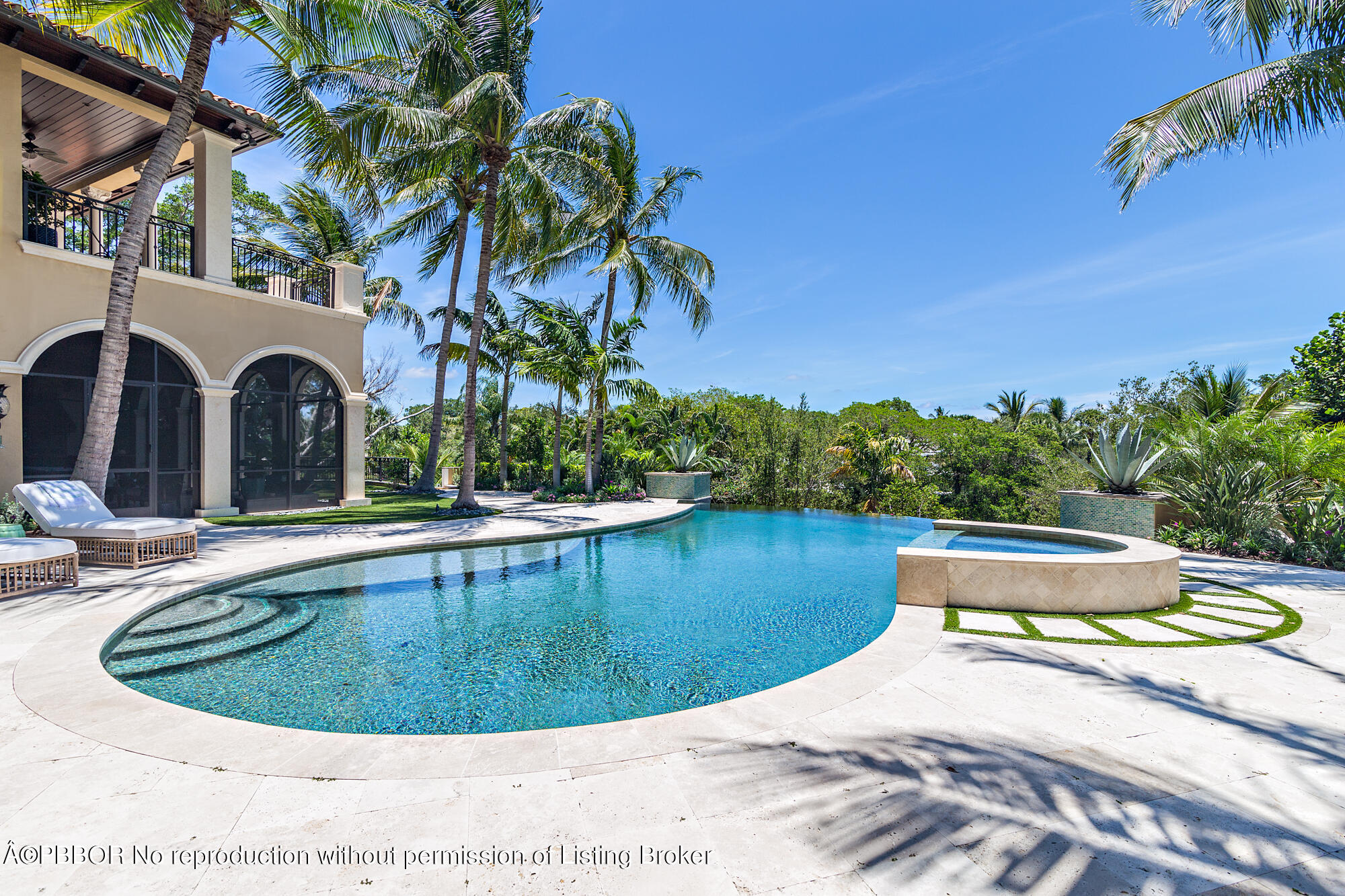 12358 Ridge Road North Palm Beach, FL 33408 - Photo 5 of 36 a view of a swimming pool with a sitting space