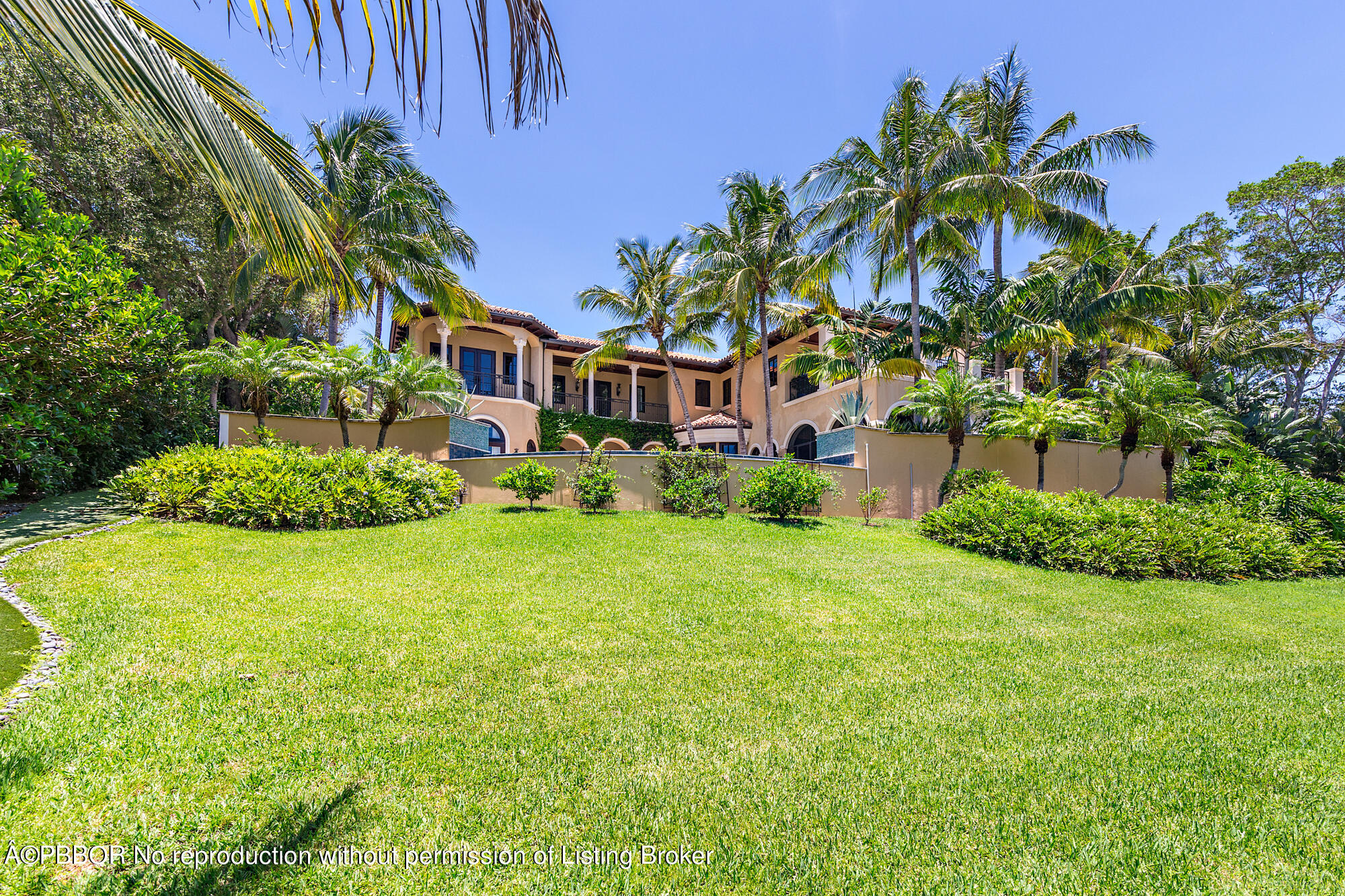 12358 Ridge Road North Palm Beach, FL 33408 - Photo 8 of 36 a front view of a house with a garden