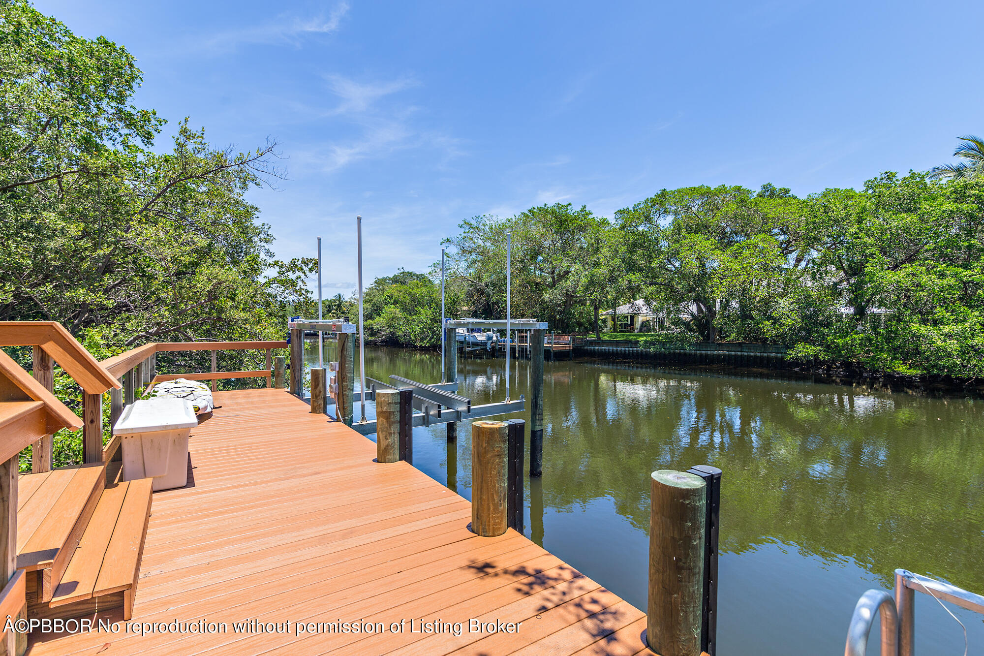 12358 Ridge Road North Palm Beach, FL 33408 - Photo 10 of 36 a wooden bridge near lake
