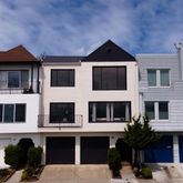 a front view of a building with many windows