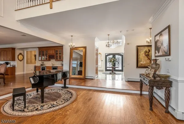 a living room with fireplace furniture and a large window