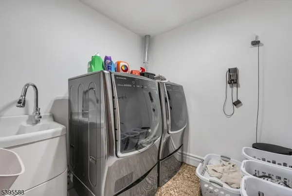 a bedroom with a bed couch and a window