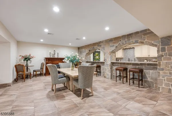 a kitchen with stainless steel appliances sink a stove and cabinets