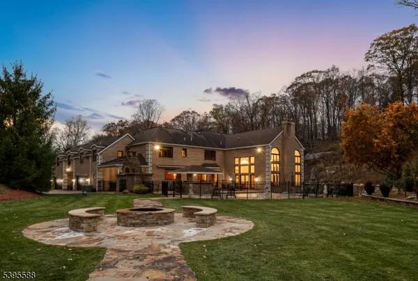 a front view of a house with outdoor seating area