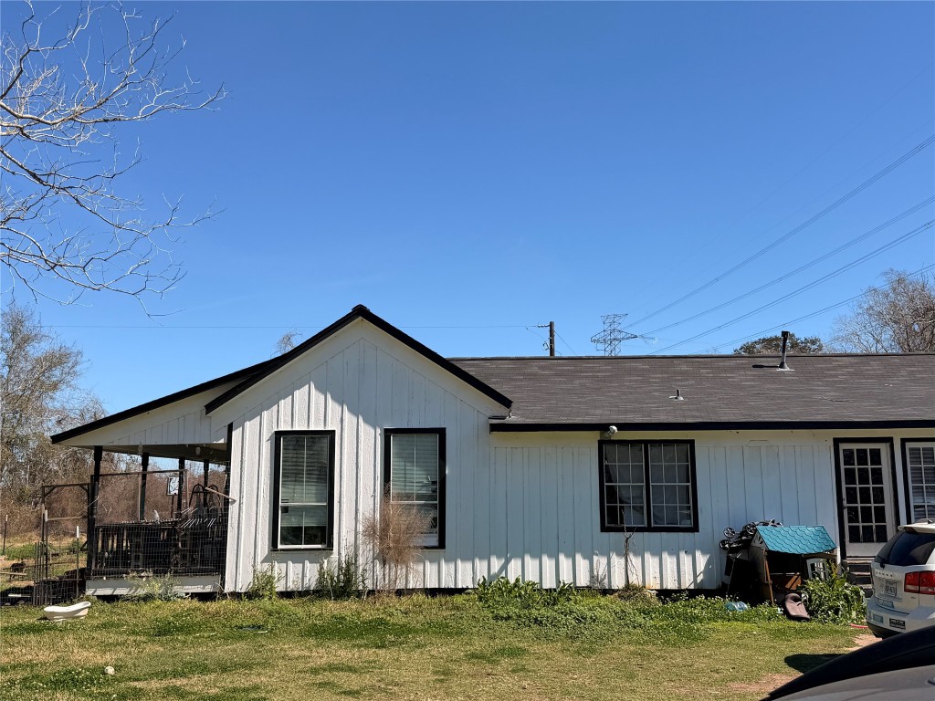 10217 Weldon Road Freeport, TX 77541 - Photo 6 of 9 a front view of a house with a yard
