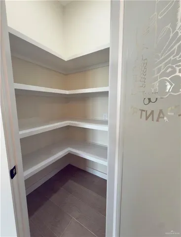 a storage room with washer and dryer