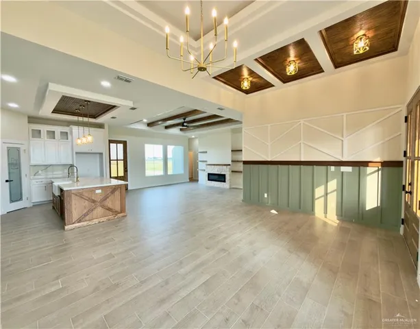 a view of a livingroom with furniture and a ceiling fan