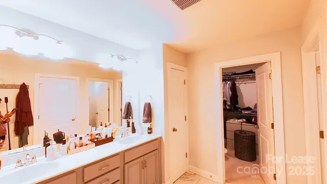 a bedroom with a bed and a desk