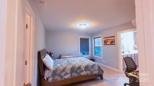 a bathroom with a sink mirror and a shower