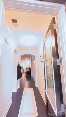 a view of a hallway view with staircase