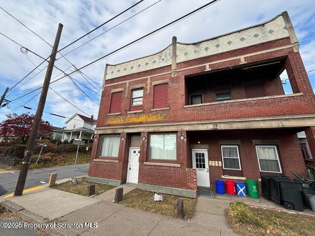 1301 Main Street, Unit 7 Dickson City, PA 18519 - Photo 1 of 7 a front view of a house with balcony
