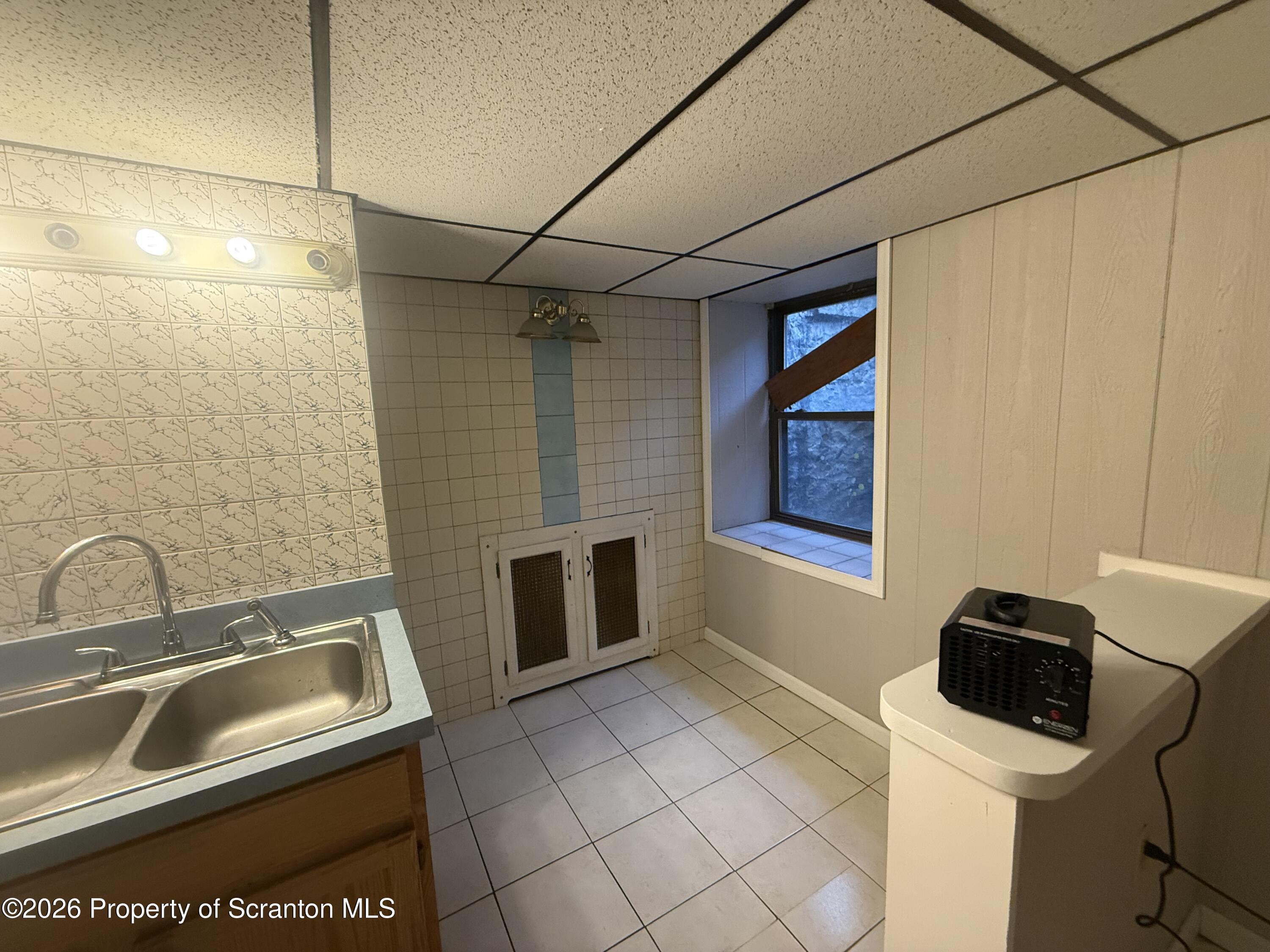 1301 Main Street, Unit 7 Dickson City, PA 18519 - Photo 3 of 7 a bathroom with a sink and toilet