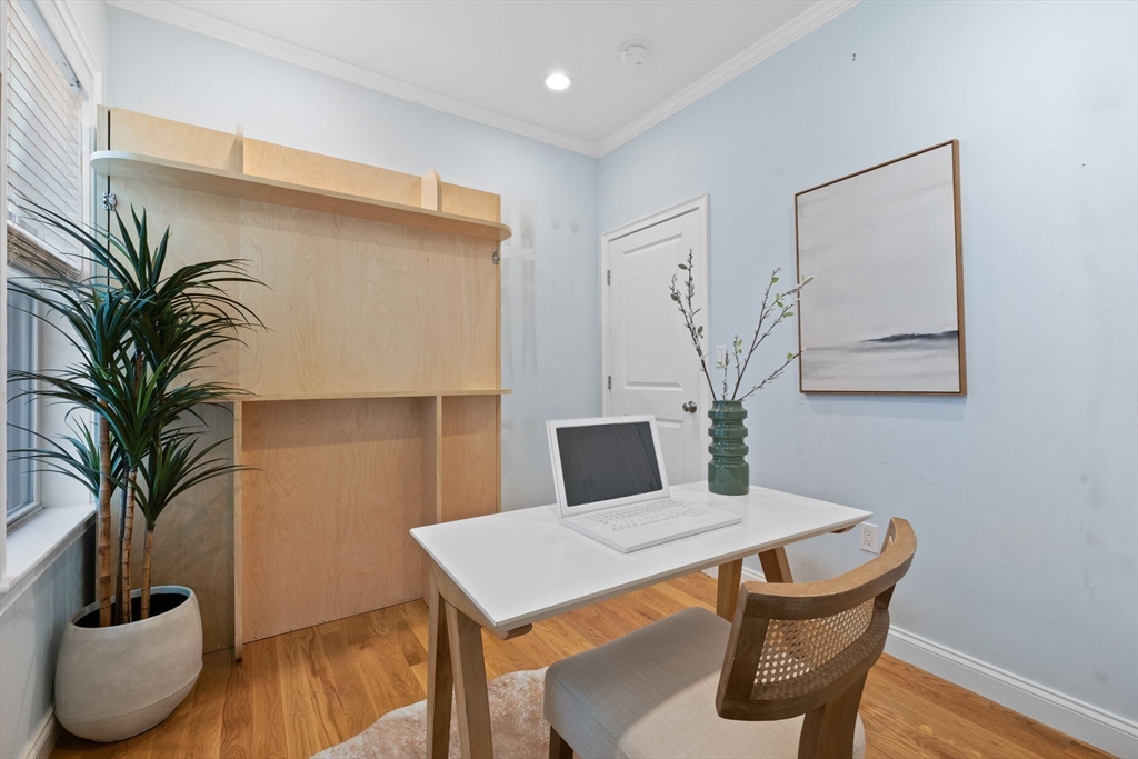 242 West Fifth Street, Unit 3 Boston, MA 02127 - Photo 21 of 37 a view of a dining room with furniture and wooden floor
