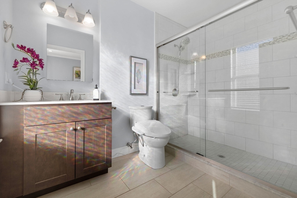 242 West Fifth Street, Unit 3 Boston, MA 02127 - Photo 22 of 37 a bathroom with a sink toilet and shower