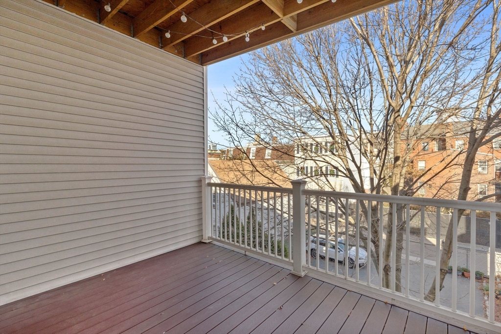 242 West Fifth Street, Unit 3 Boston, MA 02127 - Photo 5 of 37 a view of a porch with wooden floor and fence