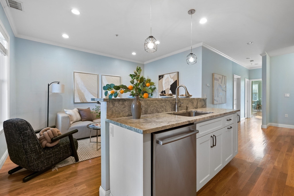 242 West Fifth Street, Unit 3 Boston, MA 02127 - Photo 10 of 37 a kitchen with counter top space and living room