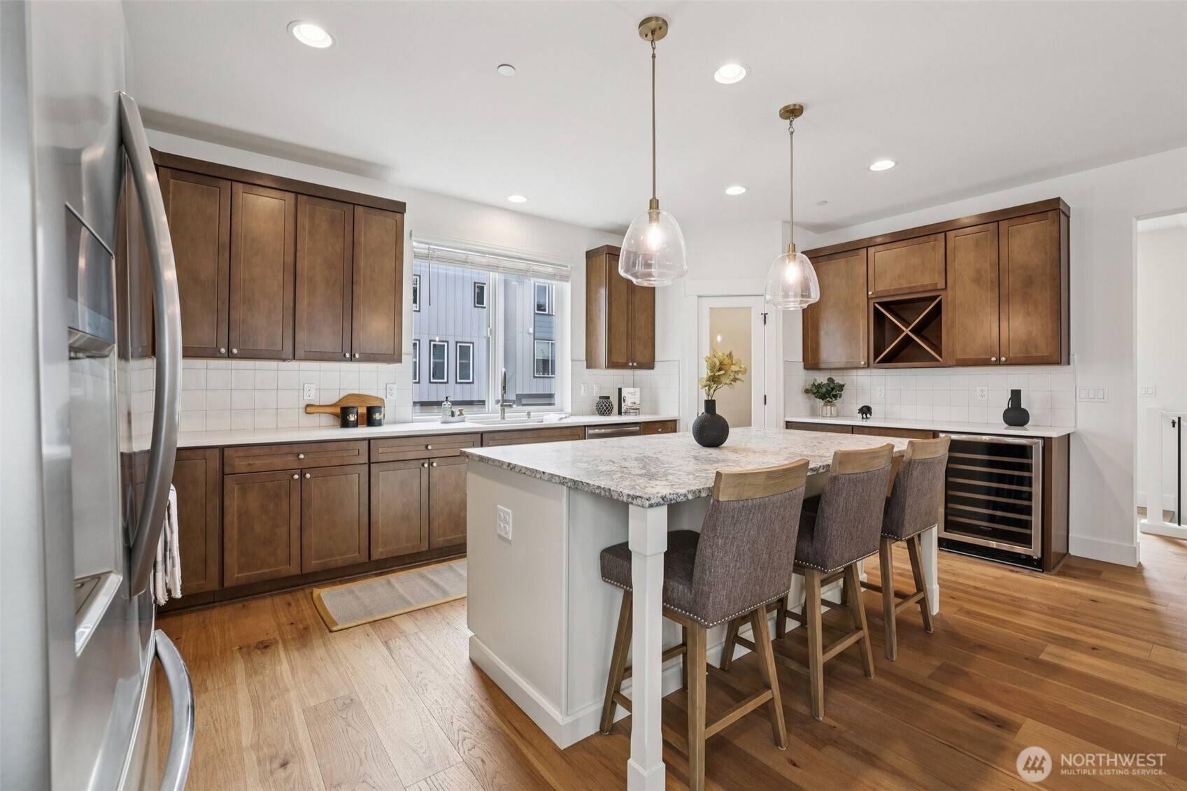 14 160th Place Southeast Bothell, WA 98012 - Photo 12 of 39 a kitchen with kitchen island granite countertop a sink counter and chairs