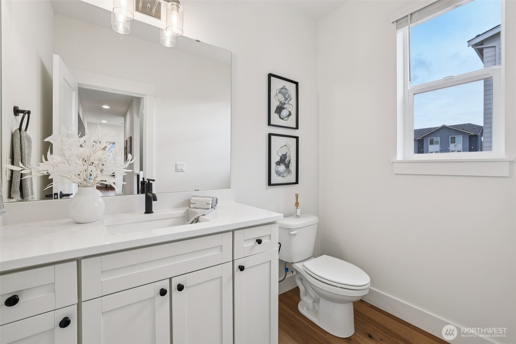 14 160th Place Southeast Bothell, WA 98012 - Photo 17 of 39 a bathroom with a toilet a sink and mirror