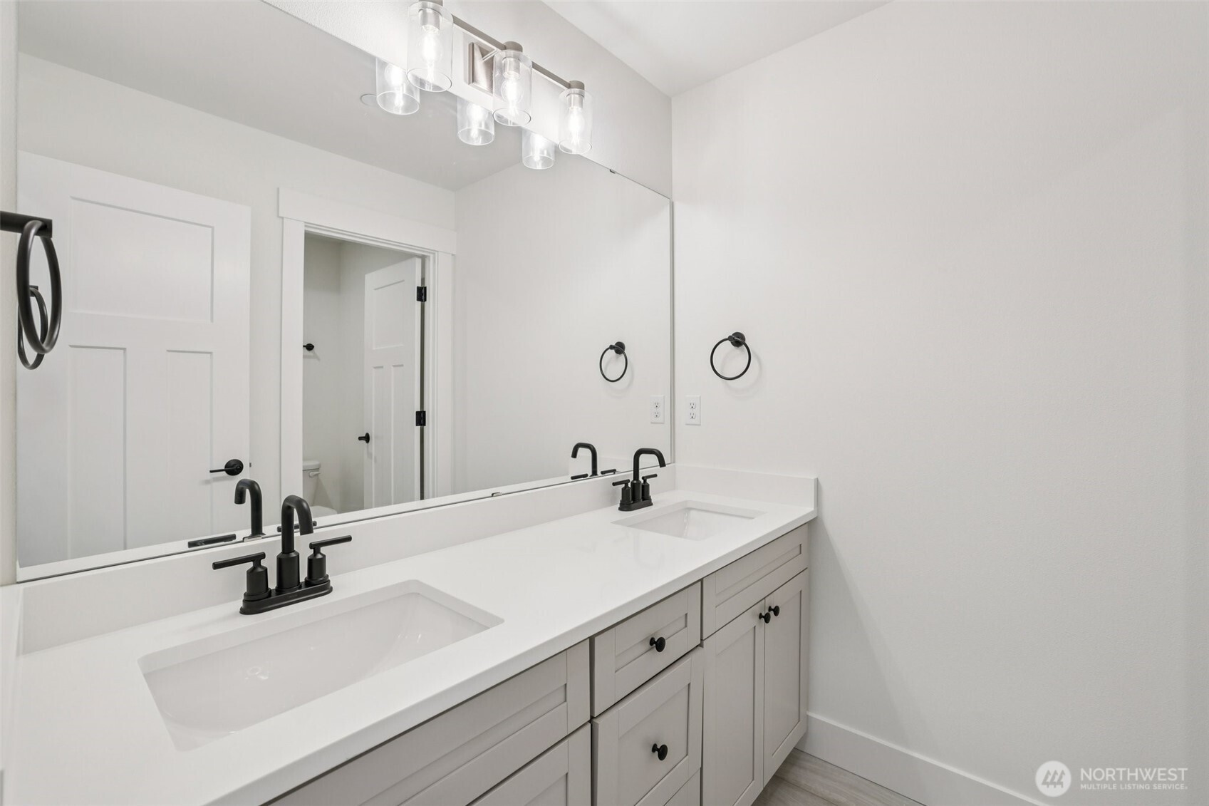 14 160th Place Southeast Bothell, WA 98012 - Photo 27 of 39 a bathroom with a sink double vanity and a mirror