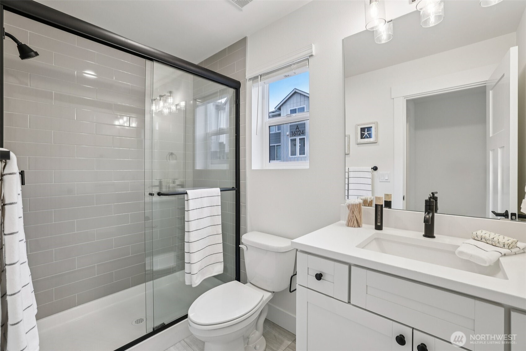 14 160th Place Southeast Bothell, WA 98012 - Photo 35 of 39 a bathroom with a sink a toilet and shower