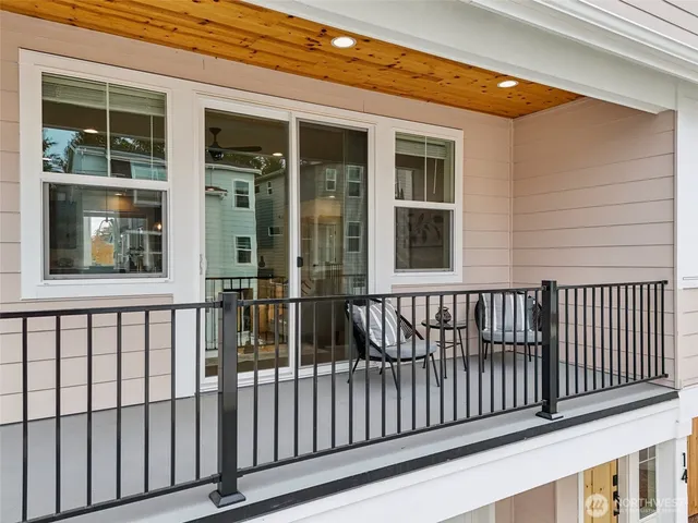 a view of balcony with furniture