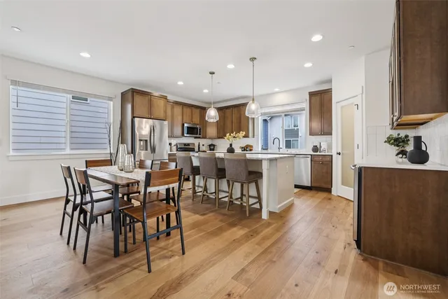 a view of a dining room with furniture and wooden floor