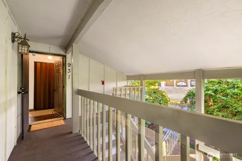 a view of swimming pool with a patio and plants