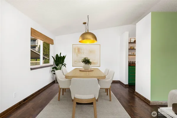 a dining room with furniture and window