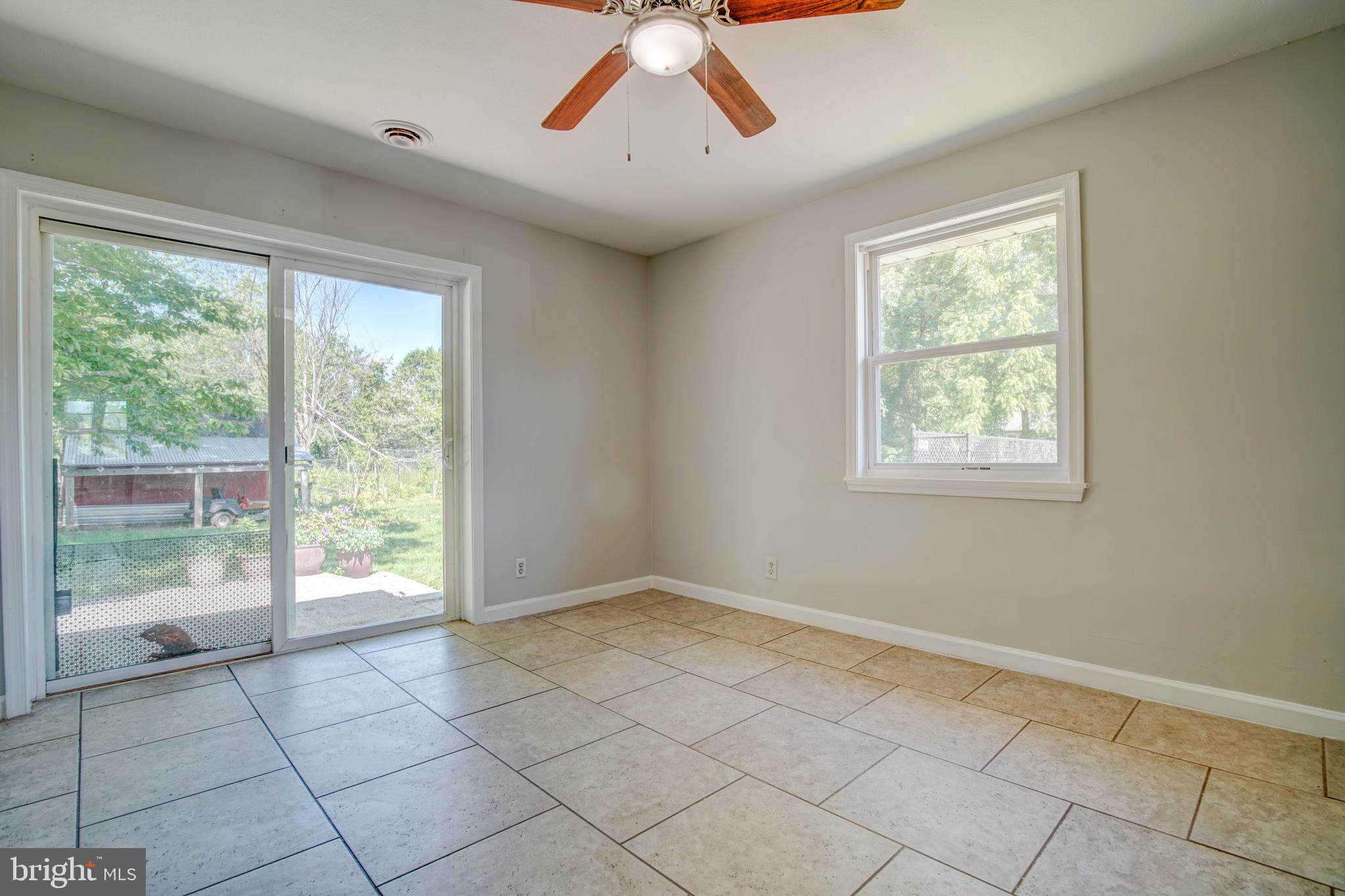 1930 Solomons Island Road Huntingtown, MD 20639 - Photo 11 of 21 a view of an empty room with a window