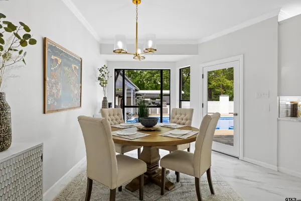 a view of a dining room with furniture window and outside view