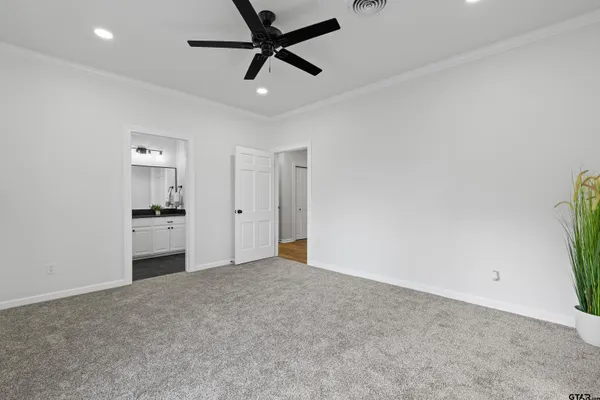 an empty room with a empty space and windows