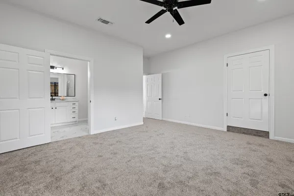 an empty room with a empty space and windows