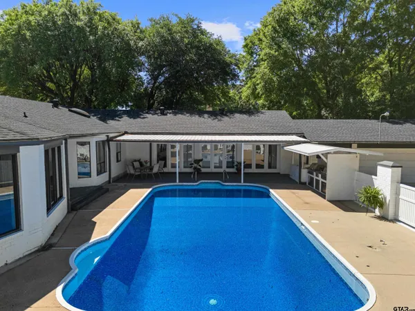 a view of house with swimming pool