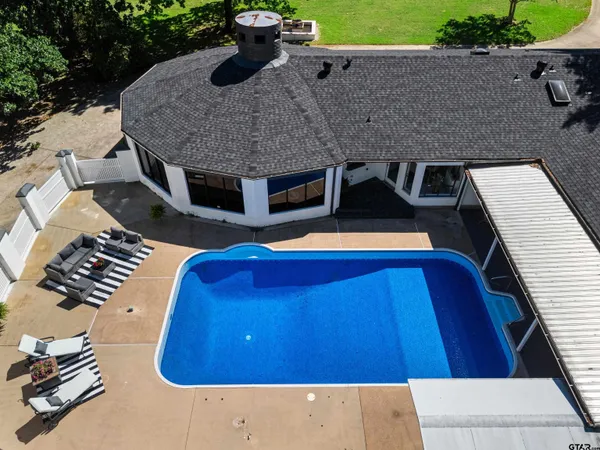 a view of a patio with swimming pool