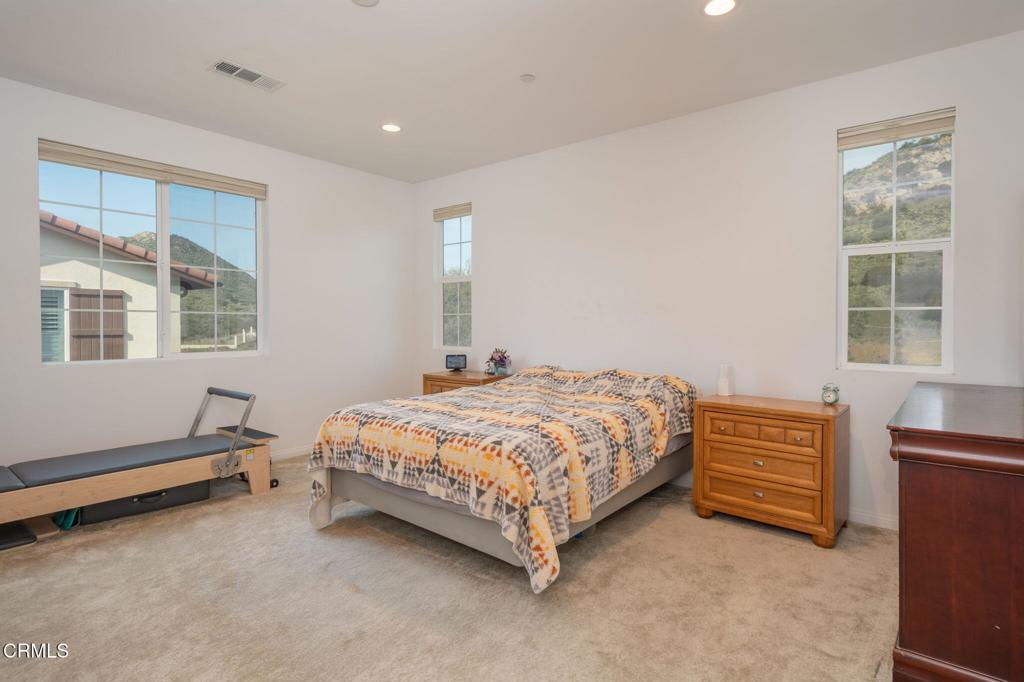 231 Inspiration Camarillo, CA 93012 - Photo 12 of 47 a bedroom with a bed and windows