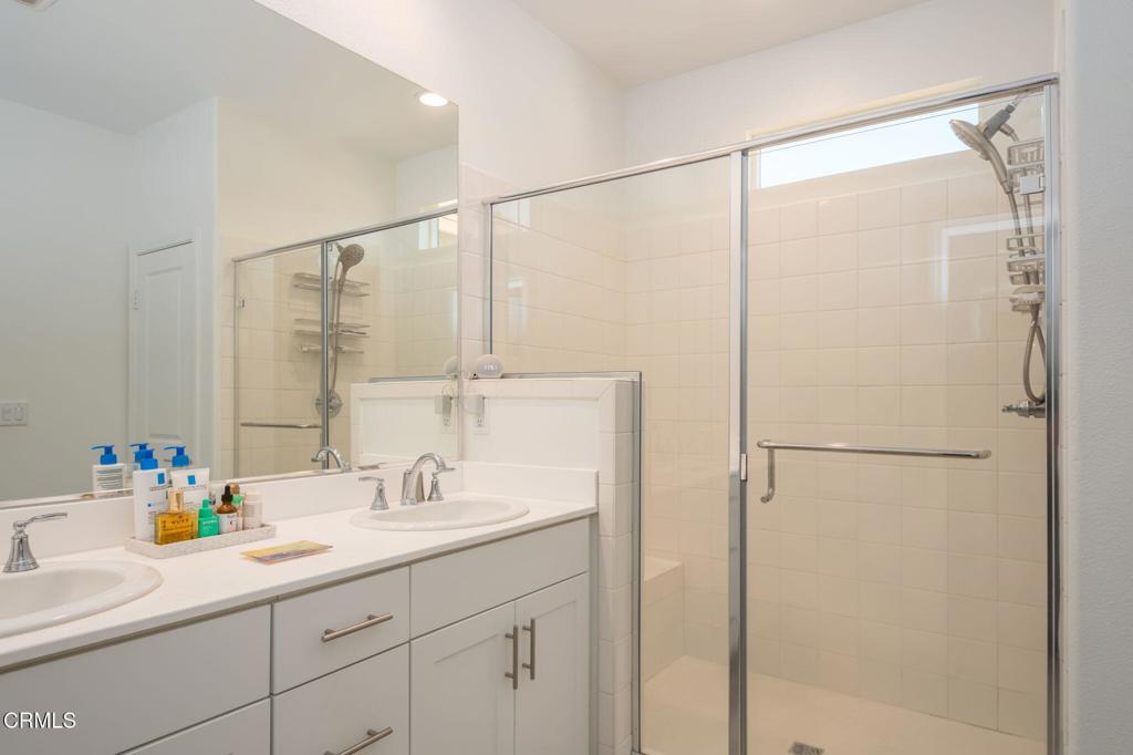 231 Inspiration Camarillo, CA 93012 - Photo 15 of 47 a bathroom with a sink and a mirror