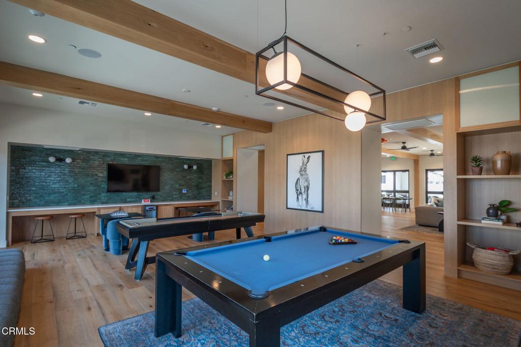 231 Inspiration Camarillo, CA 93012 - Photo 26 of 47 a living room with pool table flat screen tv and windows