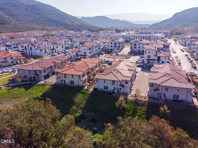 an aerial view of a house with a garden
