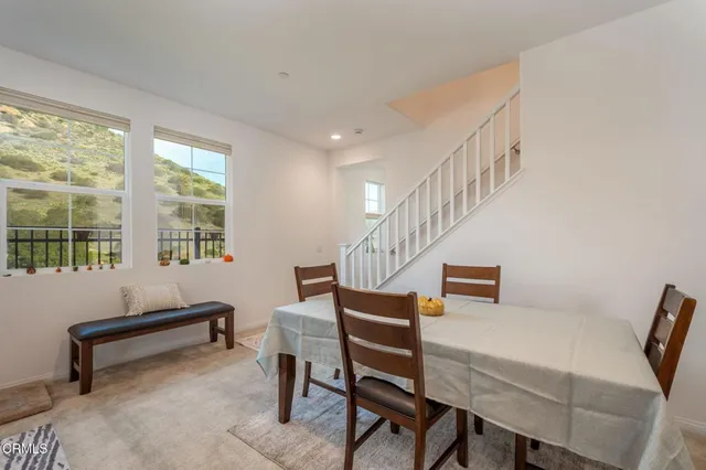 a reading room with furniture and a window
