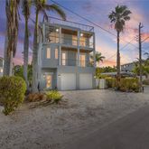 a view of a apartment building next to a yard