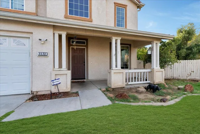 front view of a house with a yard
