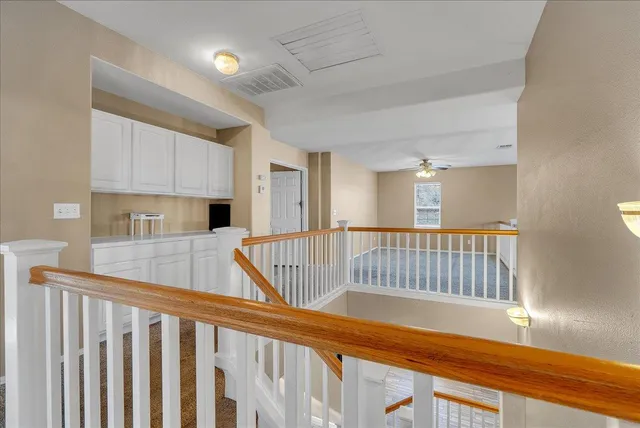a view of kitchen with furniture and wooden floor